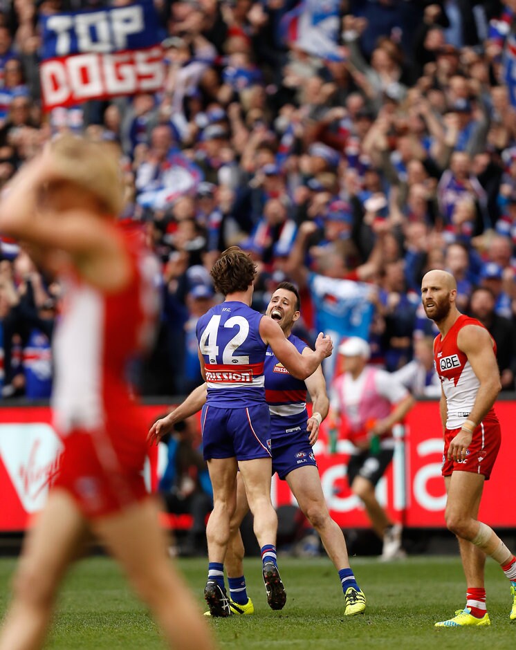 AFL 2016 Toyota AFL Grand Final - Sydney v Western Bulldogs MELBOURNE, AUSTRALIA - OCTOBER 01: Liam Picken (left) and Tory Dickson of the Bulldogs celebrate during the 2016 Toyota AFL Grand Final match between the Sydney Swans and the Western Bulldogs at the Melbourne Cricket Ground on October 01, 2016 in Melbourne, Australia. (Photo by Michael Willson/AFL Media)